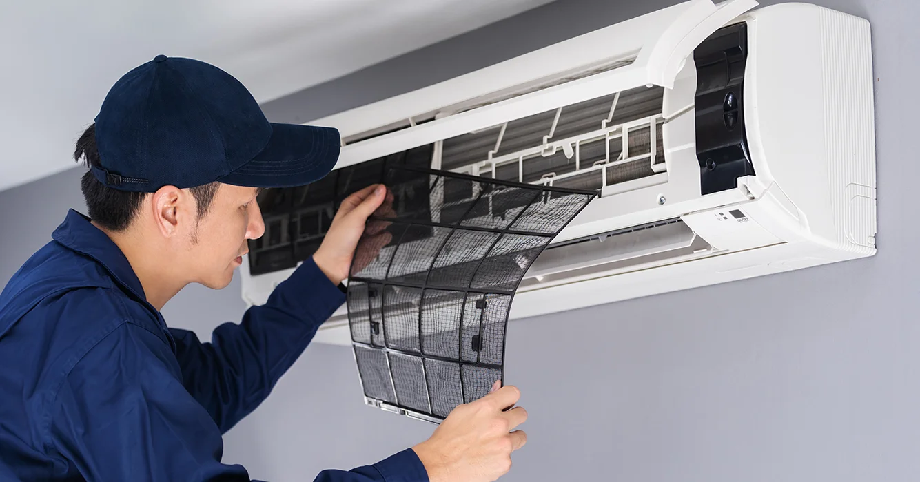 technician-service-removing-air-filter-air-conditioner-cleaning.webp